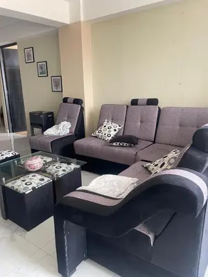 a living room with a couch and a table at Mirador Vip Apartment in Cusco