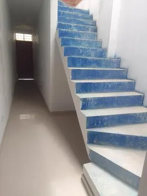 a stair case with blue steps in a building at Casa, Playa el pasamayito sur de asia in Asia