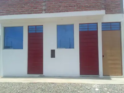 three red doors on a white building at Casa, Playa el pasamayito sur de asia in Asia