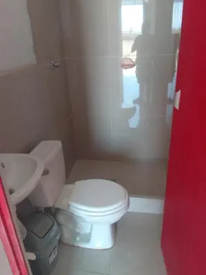 a bathroom with a white toilet and a sink at Casa, Playa el pasamayito sur de asia in Asia