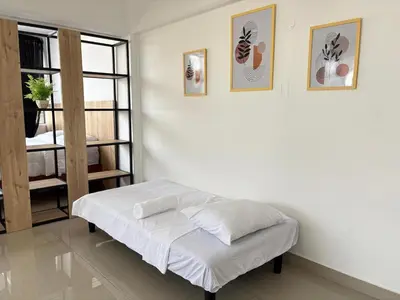 a white room with a bed and a window at Apartment in Lima in Lima