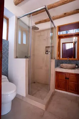 a bathroom with a shower with a toilet and a sink at Stunning 1BR House in Camino Real in Urubamba