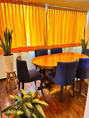 a conference room with a wooden table and chairs at Green Love in Lima