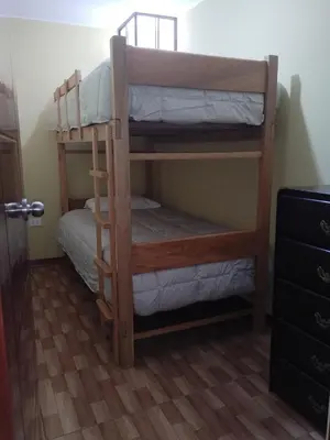 a couple of bunk beds in a room at Habich Apartment in Lima