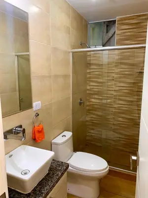 a bathroom with a toilet and a sink and a shower at Departamento San Bartolo, Excellent Location! in San Bartolo