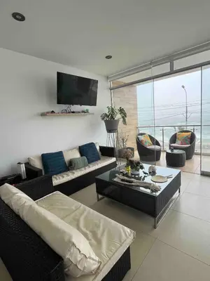 a living room with two couches and a television at Departamento San Bartolo, Excellent Location! in San Bartolo
