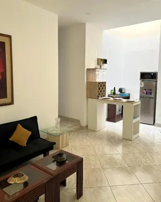 a living room with a couch and a table at Casa Molinera in Lima