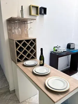 a kitchen with a table with plates and wine glasses at Casa Molinera in Lima