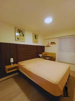 a bedroom with a large bed and a desk at Perfect location in Barranco in Lima