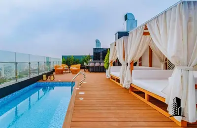 a balcony with beds and a pool on a building at Perfect location in Barranco in Lima