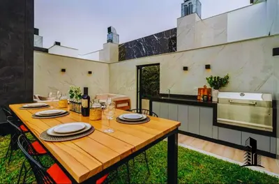 a wooden table in the middle of a kitchen at Perfect location in Barranco in Lima