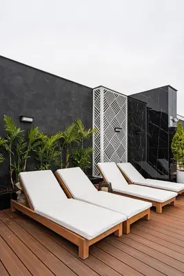 a row of chaise lounges on a deck at Artline by Geko in Lima
