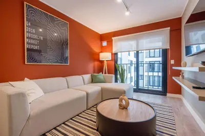 a living room with a couch and a table at Artline by Geko in Lima