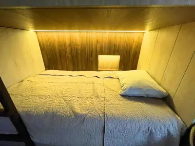 a bedroom with a bed with a light on it at Chelovirock- Luxury Penthouse Great Location in Lima
