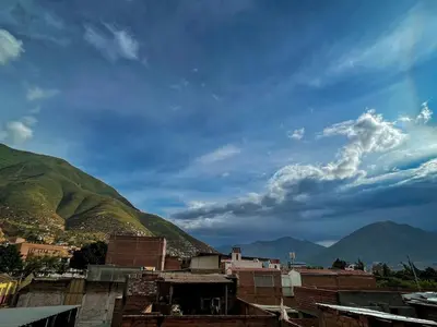 a view of a city with mountains in the background at House Sacha 1BR Great View Huanuco in Huánuco