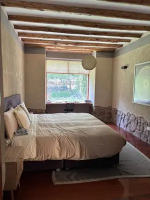 a bedroom with a large bed and a window at Luxury house in Urubamba, Cusco, Perú in Urubamba