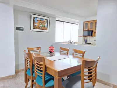 a dining room with a wooden table and chairs at Jerusalen Inn-Dep 3 in Cusco