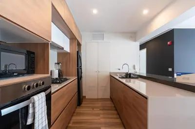 a kitchen with a stove and a microwave at Eco 28 by Geko in Lima