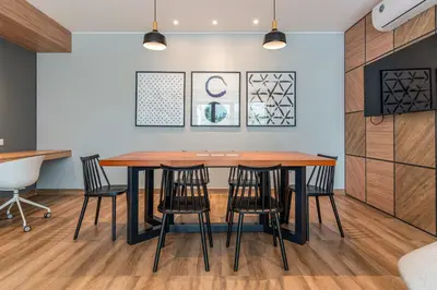 a dining room with a table and stools at Eco 28 by Geko in Lima