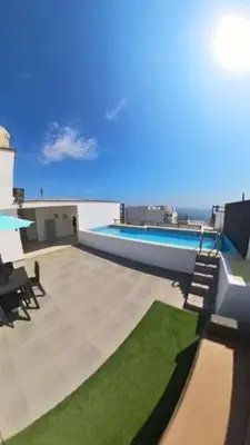 a patio with a swimming pool on top of a building at Casa de Playa en Pulpos Punta Hermosa in Lurín