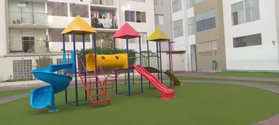 a playground with a slide in a building at Departamento 5p Lima Centro 3 dormitorios 4 camas in Lima