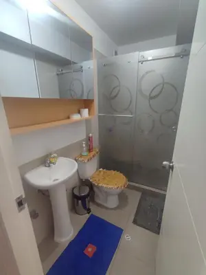 a bathroom with a shower and a toilet and a sink at Depa moderno - Aeropuerto, San Marcos, Católica in Lima