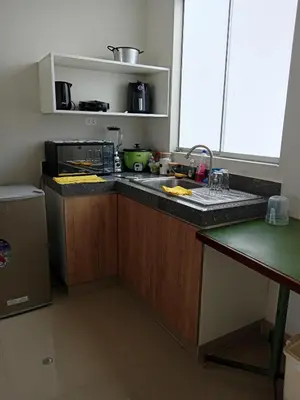a kitchen with a sink and a counter top at Huacachina house in Ica