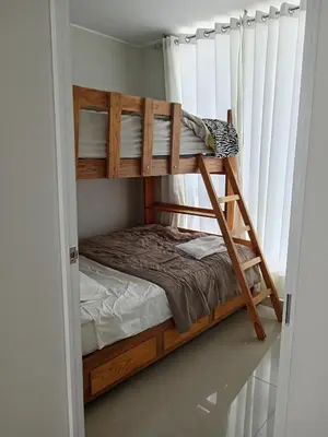 a bunk bed in a room with a bunk bed in a room at Huacachina house in Ica