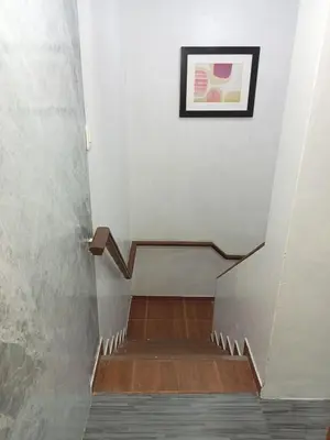 a stairway with a picture on the wall at Departamento 2 HABITACIONES 1A in Lima