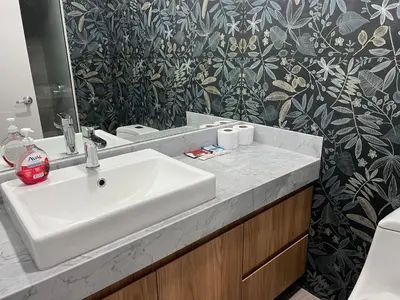 a bathroom with a white sink and a toilet at Design Apartment with city view! - Miraflores in Lima