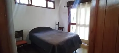 a bedroom with a bed and a window in a room at Bungalow 23 in El Carmen