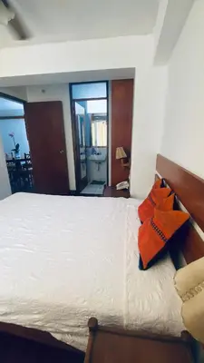 a bedroom with a bed with two pillows on it at Lindo departamento en Miraflores Parque Kennedy in Lima