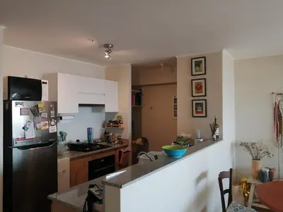 a kitchen with a refrigerator and a counter top at Acogedor y cómodo departamento de 2 Habitaciones en Magdalena in Lima