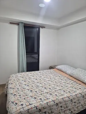 a bedroom with a bed and a window at Apartamento Mary in Lima