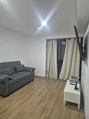 a living room with a couch and a table at Apartamento Mary in Lima