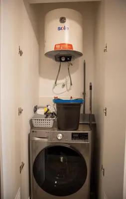 a kitchen with a pot on top of a washing machine at Art by Wynwood House in Lima
