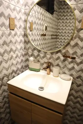 a bathroom with a sink and a mirror at Casa Canal - 3 cuadras de la Plaza de Armas in Cusco
