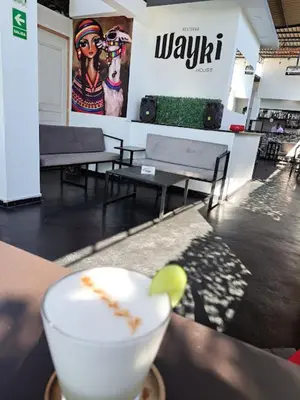 a drink sitting on a table in a store at Wayki House in Ica