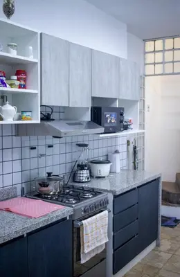 a kitchen with a stove and a counter top at Gutierrez Hostel in Lima