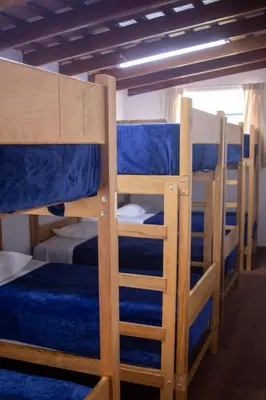 a group of bunk beds in a room at Gutierrez Hostel in Lima