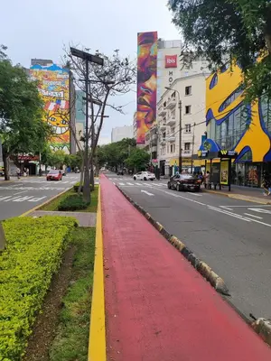 a red sidewalk on the side of a city street at Céntrica y amplia habitación queen Av Larco in Lima