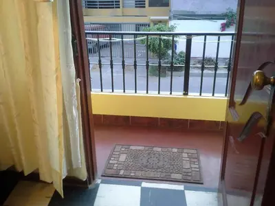an open door with a view of a balcony at Modern Apartmen Furnished in Lima Near the Airport in Lima