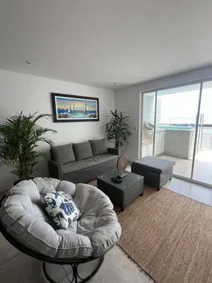 a living room with a couch and a table at Comfortable duplex - Punta Hermosa in Punta Hermosa