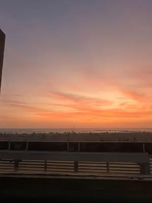 a view of the beach at sunset from a train at Comfortable duplex - Punta Hermosa in Punta Hermosa