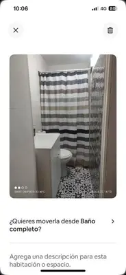 a bathroom with a toilet and a shower at Minidepa Ecléctico in Lima