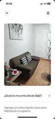 a living room with a couch and a table at Minidepa Ecléctico in Lima