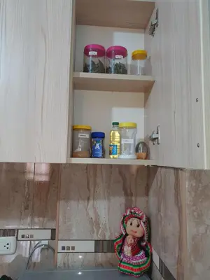 a doll sitting on top of a kitchen counter at Your 2nd home in residential area in Cusco