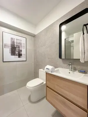 a bathroom with a toilet and a sink and a mirror at Syberia 2BR by Geko in Lima
