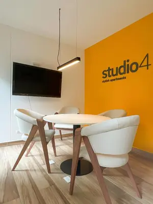 a dining room with a table and two chairs at Studio 4 by Geko in Lima