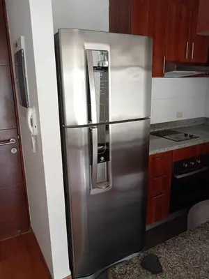a stainless steel refrigerator in a kitchen at Departamento amoblado vacacional in Lima